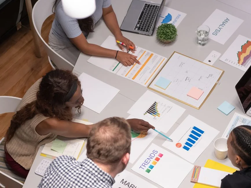 Sticky notes featuring holiday marketing ideas for Christmas social media and email campaigns.